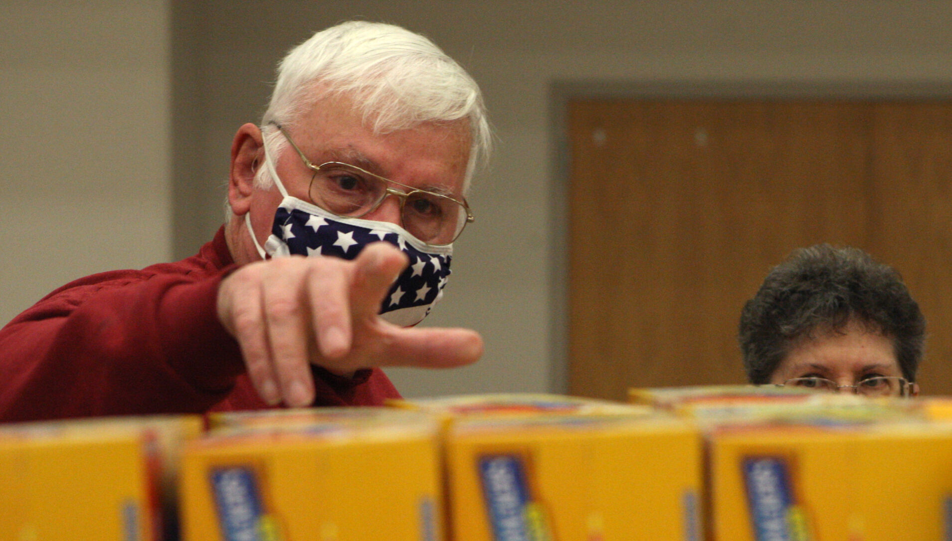 Dave Gilbert and Sandra Meier grab grocery items